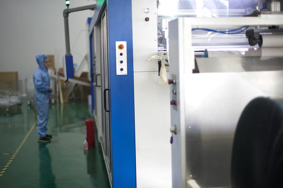 Close view of a Yinling thermoforming station processing plastic sheet